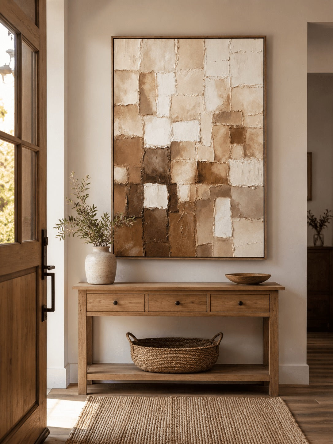 Beige, cream and brown mosaic-like blocks above an entryway table
