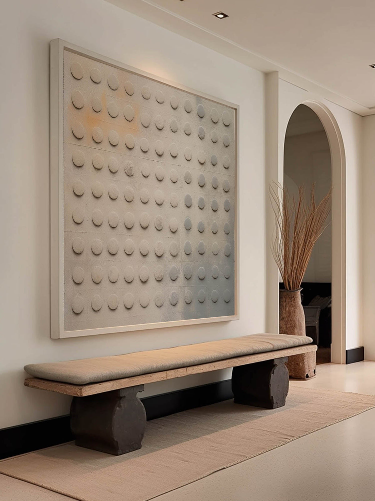 Rows of rounded gray relief dots on beige above a wooden bench