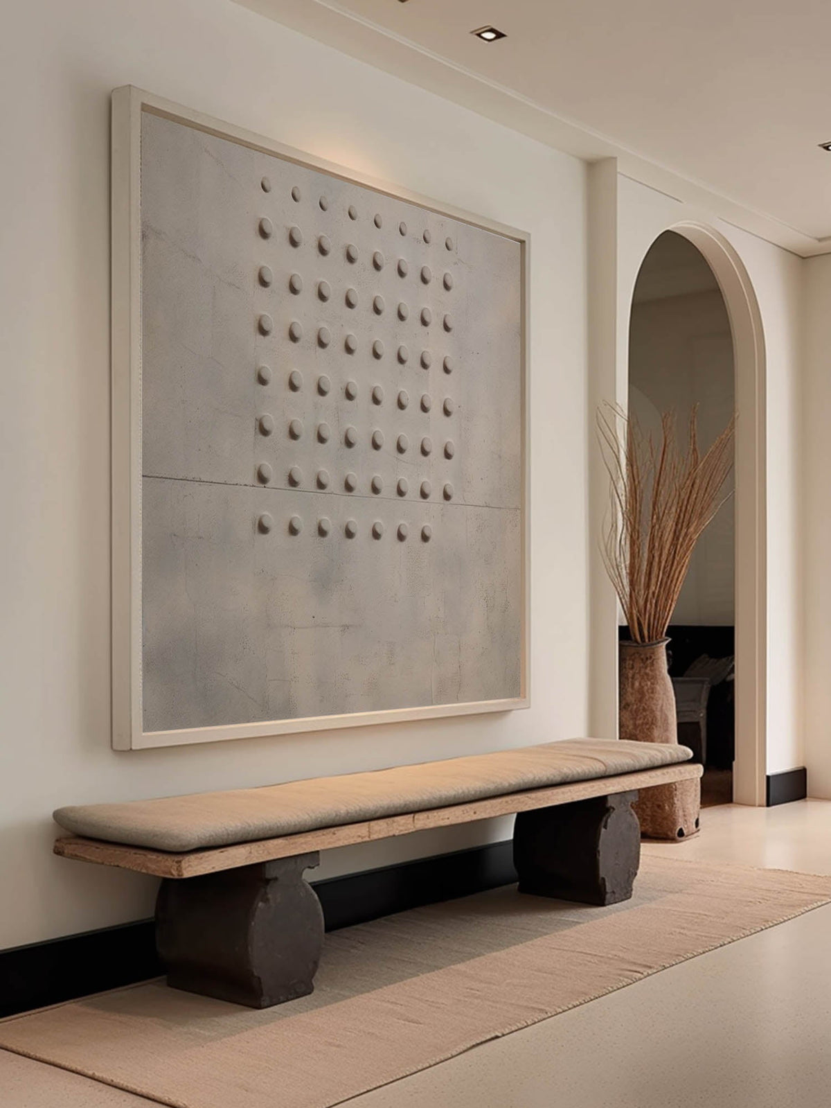 A compact grid of small dark relief dots on beige above a wooden bench