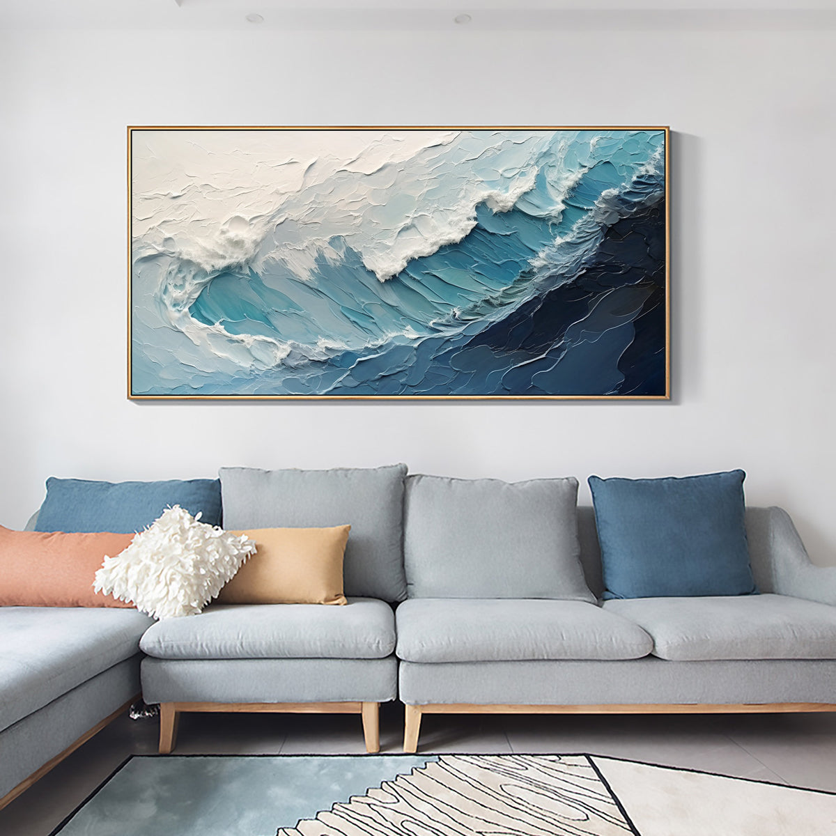 A crashing blue wave with broad white foam above a light blue sofa