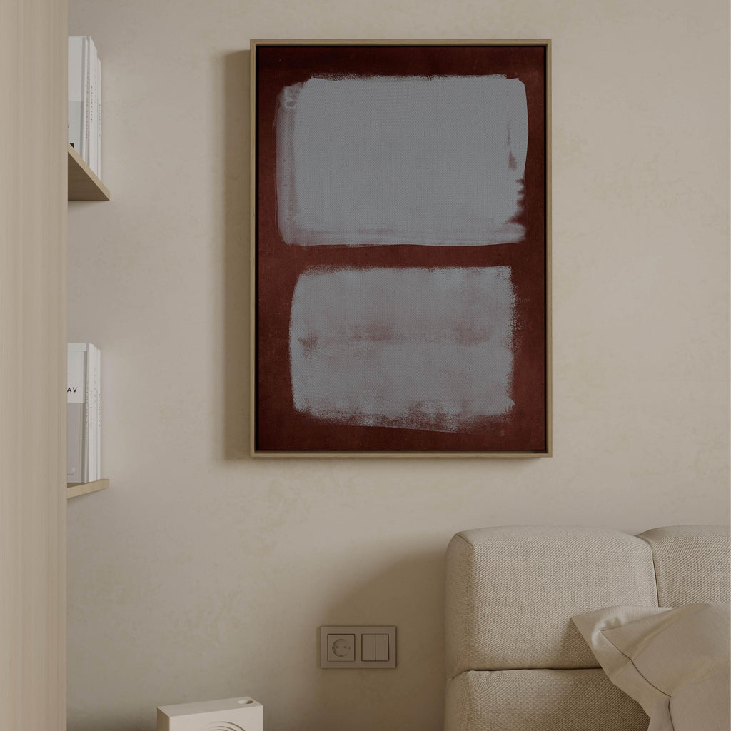 Two blue gray fields within a burgundy border above a pale sofa
