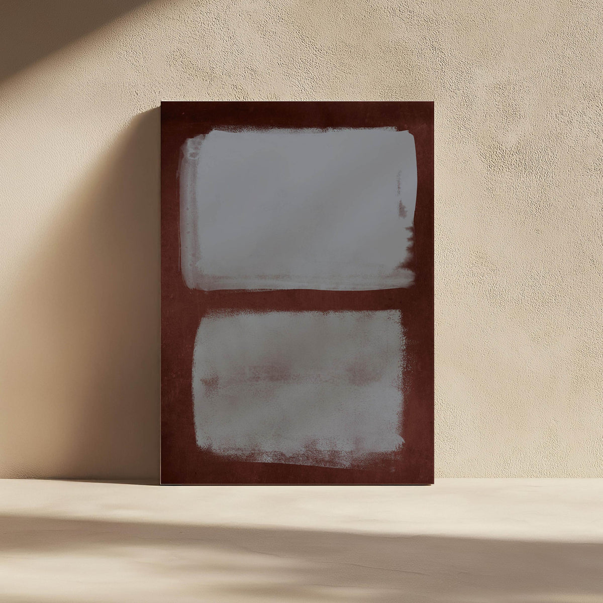 Two blue gray fields within a burgundy border on a sunlit wall