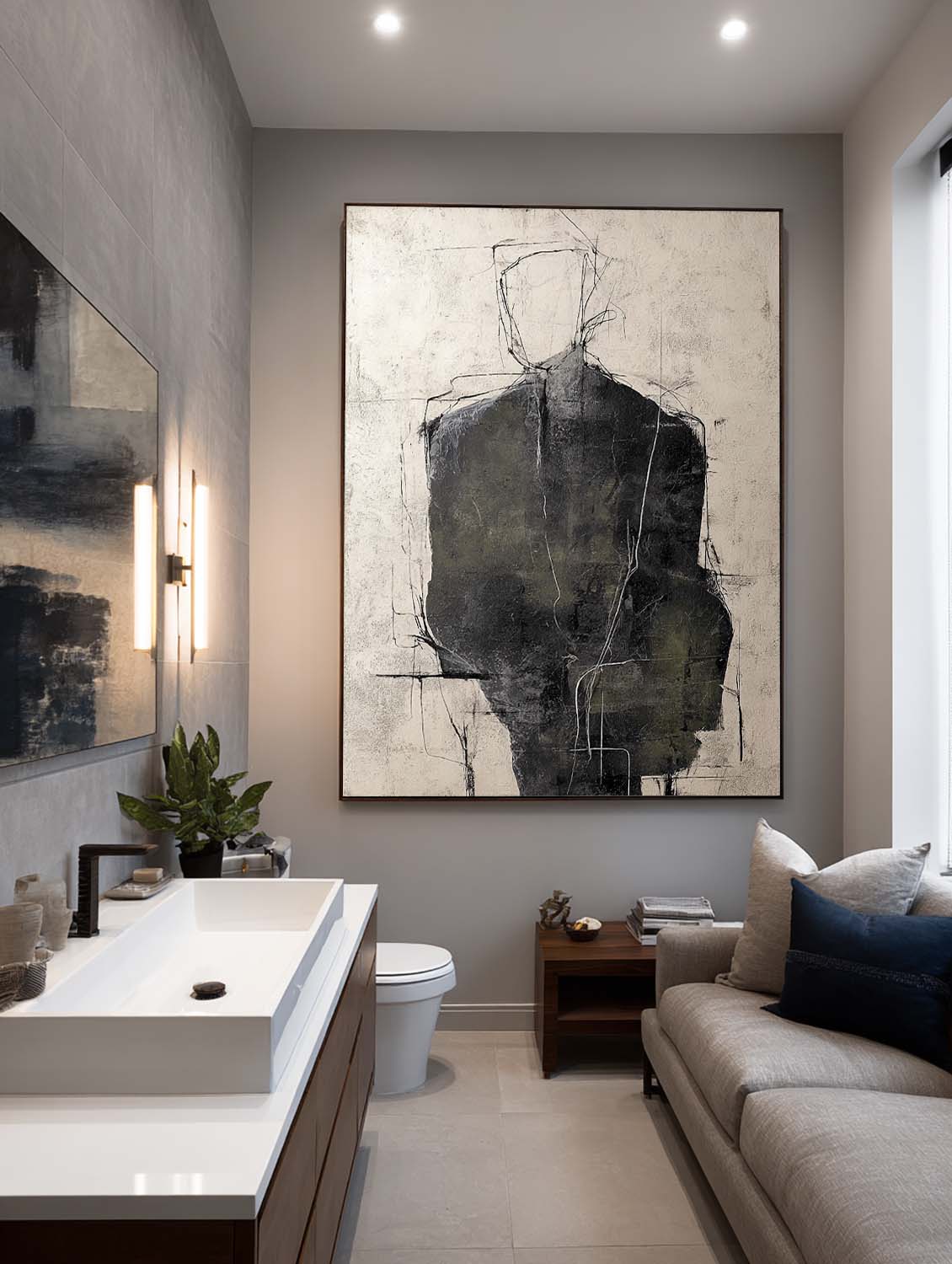 A charcoal figure with a fine outlined head on beige above a pale sofa