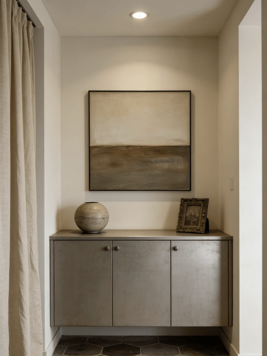 Neutral horizon painting above a hallway console