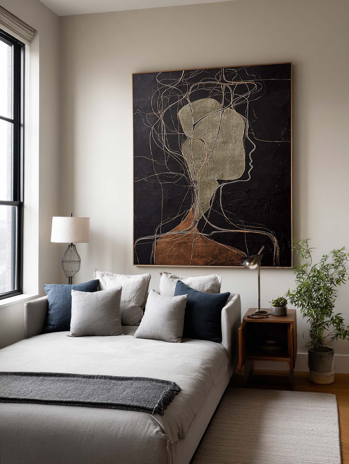 A pale abstract side profile with looping lines on black above a bed