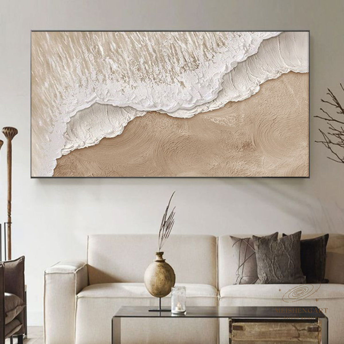 A broad white foamy shoreline over beige above a pale sofa
