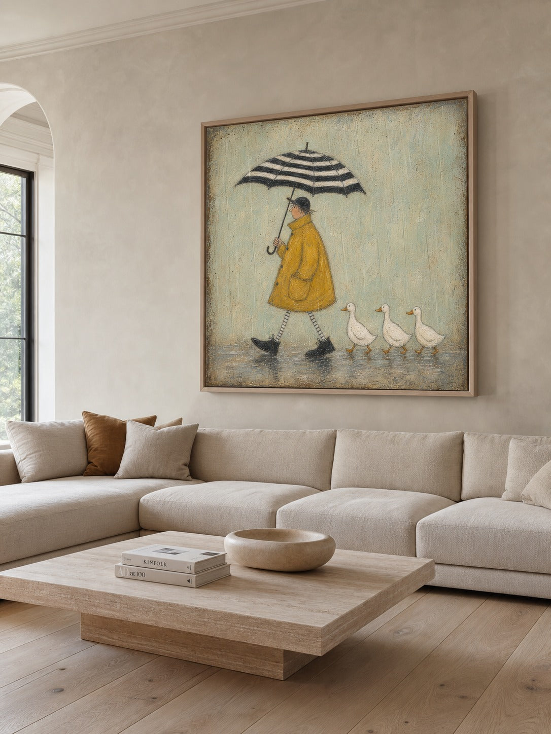 Yellow-coated figure canvas above a neutral sofa